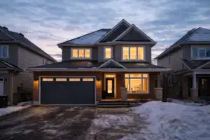 Ottawa suburban home in winter with snow-covered roof